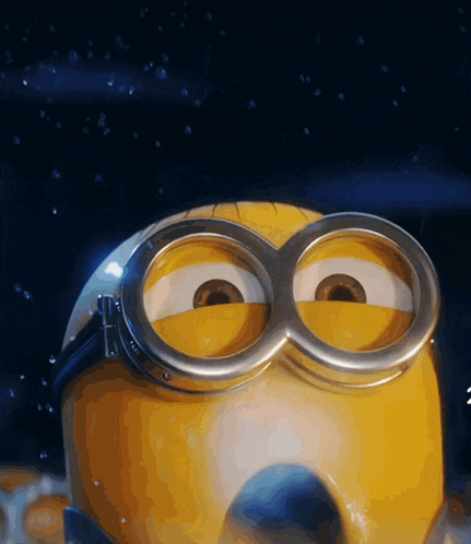 a close up of a minion wearing goggles with a h on it