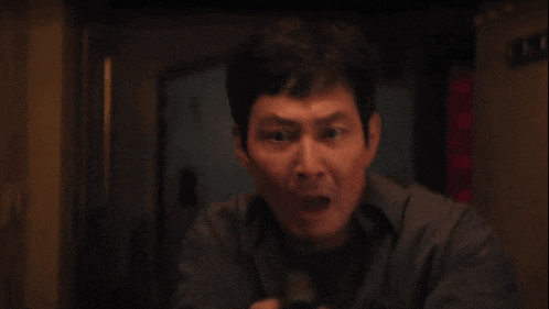 a man is holding a lighter in his hand and lighting it up