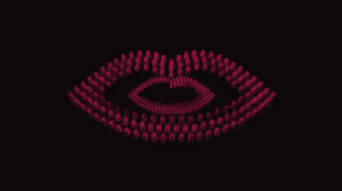 a close up of a woman 's lips made of red lipsticks on a black background .