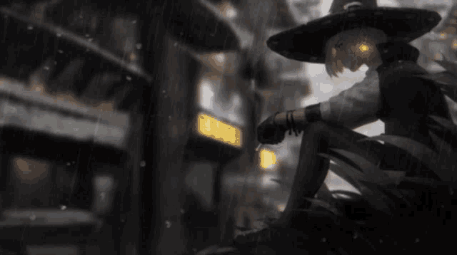a person wearing a witch hat is sitting on the ground