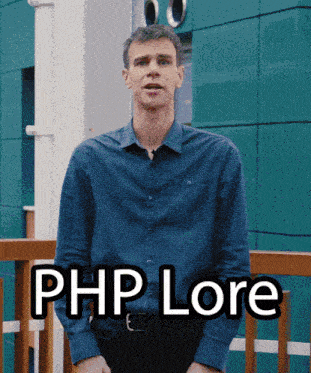 a man in a blue shirt stands in front of a building with the words php lore written on the front