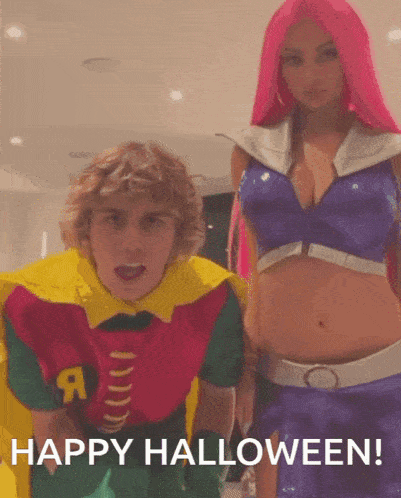 a man in a robin costume is standing next to a woman in a starfire outfit
