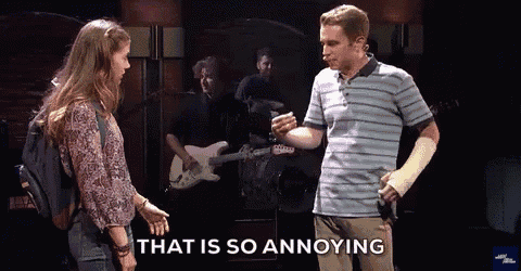 a man with a cast on his arm is standing next to a woman and says that is so annoying .