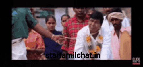 a group of people are standing in a crowd with the website starttamilchat.in in the bottom right corner