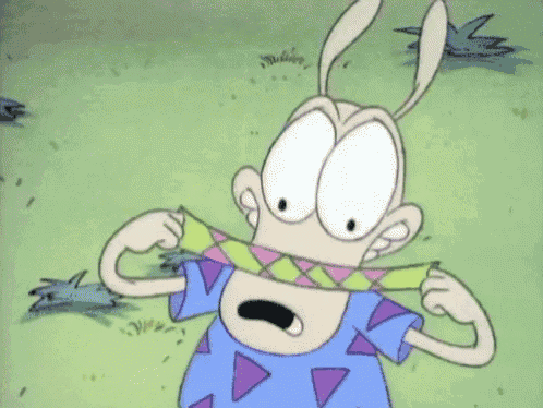 a cartoon character is holding a ribbon in his mouth