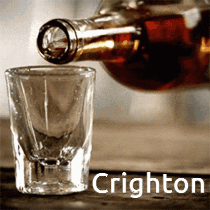 a shot glass is being poured from a bottle that says crighton