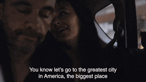 a group of people are walking down a street with the words " you know let 's go to the greatest city in america "