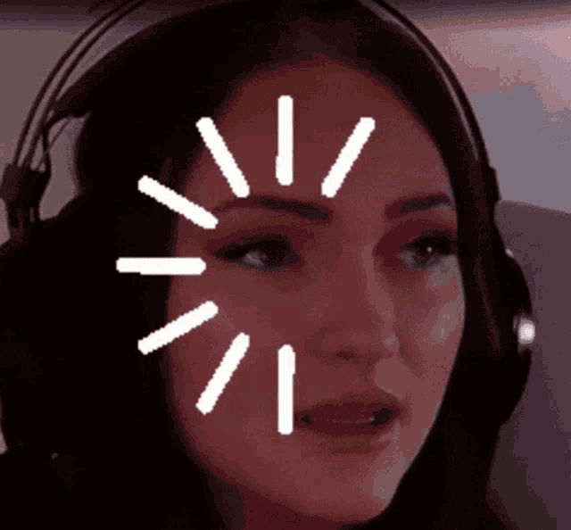 a woman wearing headphones has a white circle around her face .