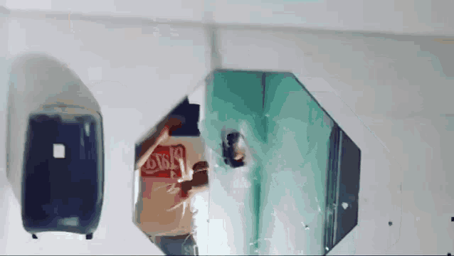a mirror with a reflection of a person and the word disco on it