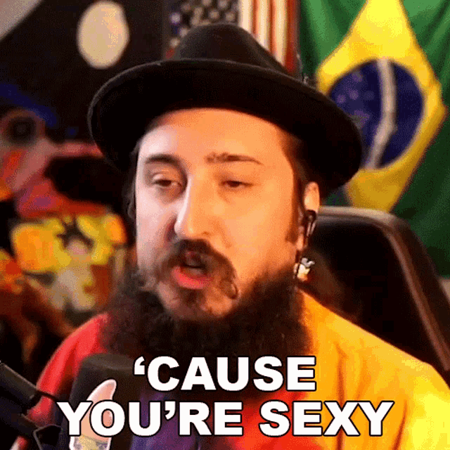 a man with a beard wearing a hat says cause you 're sexy