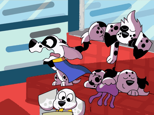 a dalmatian dog wearing a blue cape stands next to another dalmatian dog