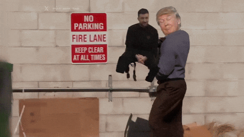 donald trump is standing in front of a no parking sign