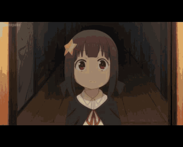 a girl with a star in her hair looks surprised in a hallway