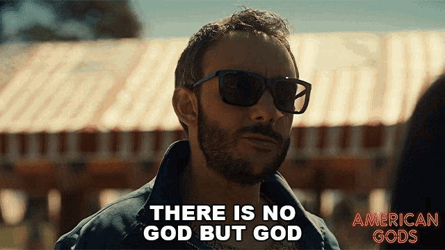 a man wearing sunglasses is saying there is no god but god