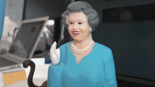 a statue of queen elizabeth wearing a blue dress and white pearls