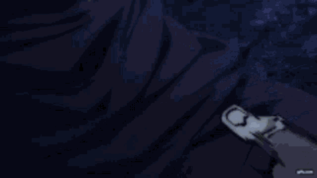 a close up of a person 's hand with a glowing light coming out of it