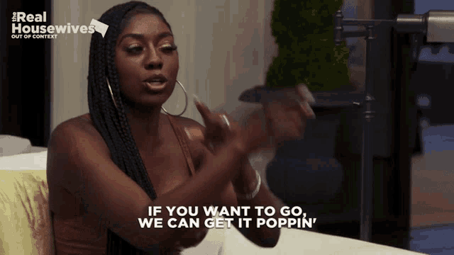 a woman sitting on a couch with the words if you want to go we can get it poppin