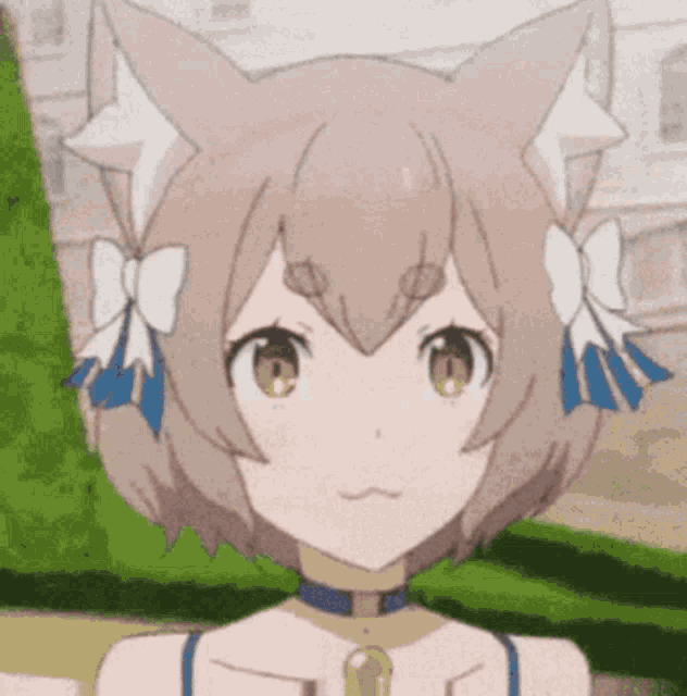 a close up of a girl with cat ears and a bow in her hair