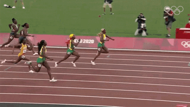 Running Elaine Thompson Herah GIF - Running Elaine Thompson Herah Team Jamaica GIFs
