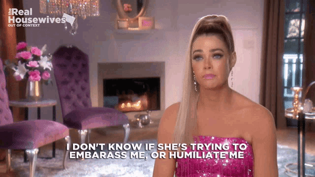 a woman in a pink dress says i don 't know if she 's trying to embarass me