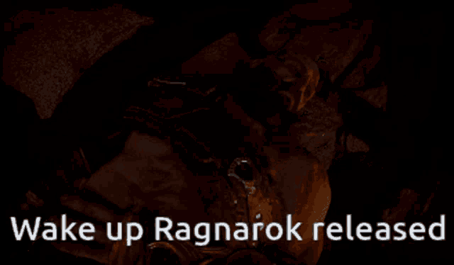 a man with a beard is laying in bed with the words wake up ragnarok released