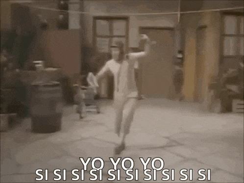 a woman in a white dress is dancing in front of a building .