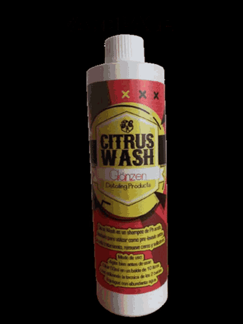 a bottle of citrus wash sits on a black surface