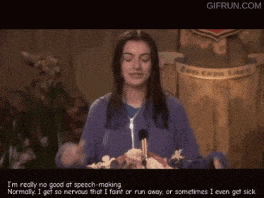 a woman in a purple sweatshirt stands in front of a microphone and says i 'm really no good