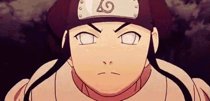 a close up of a cartoon character wearing a headband with a symbol on it .