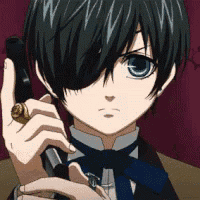a close up of a person holding a gun with a ring on their finger