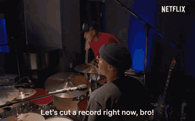 a man wearing a purple beanie and sunglasses says " let 's cut a record right now bro "