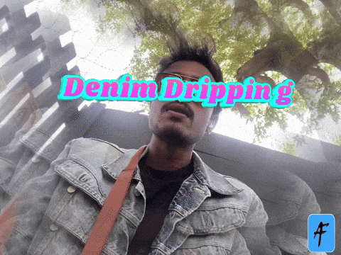 a man wearing a denim jacket with the words denim dripping behind him