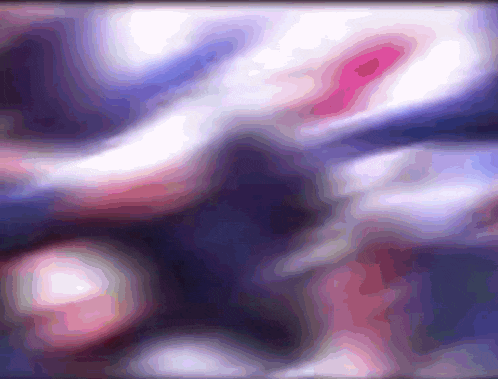 a blurred image of a person 's face with a blue background