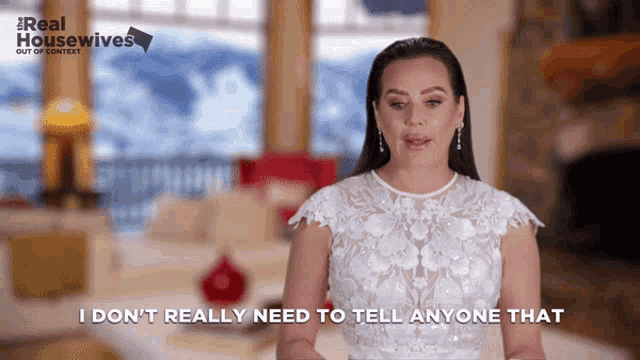a woman in a white dress says i do n't really need to tell anyone that