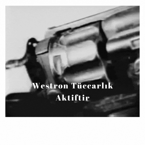 a black and white photo of a revolver with the words westron tüccarlik aktiftir on the bottom