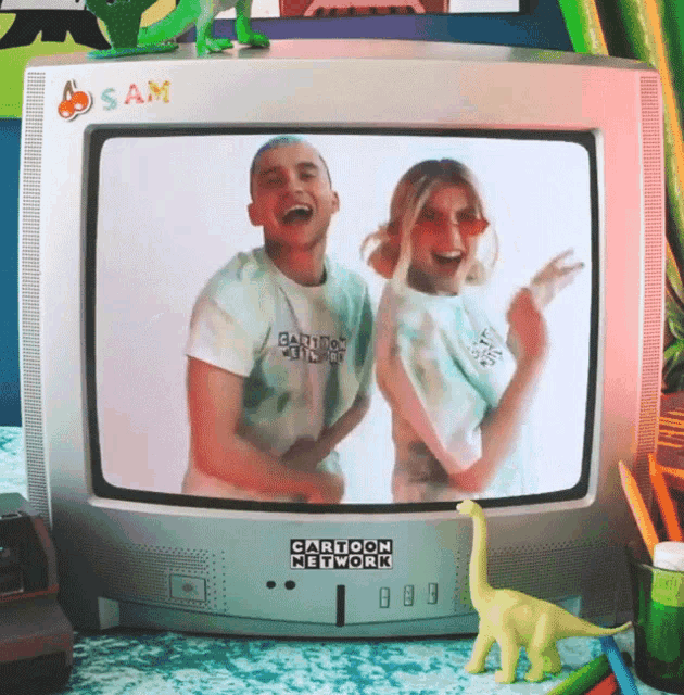 a cartoon network tv shows a man and a woman on the screen