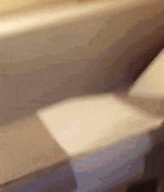 a blurred image of a person sitting on a bench