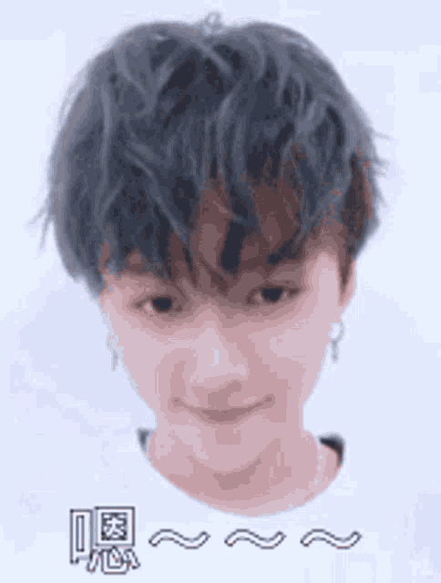 a close up of a person 's face with chinese characters on it