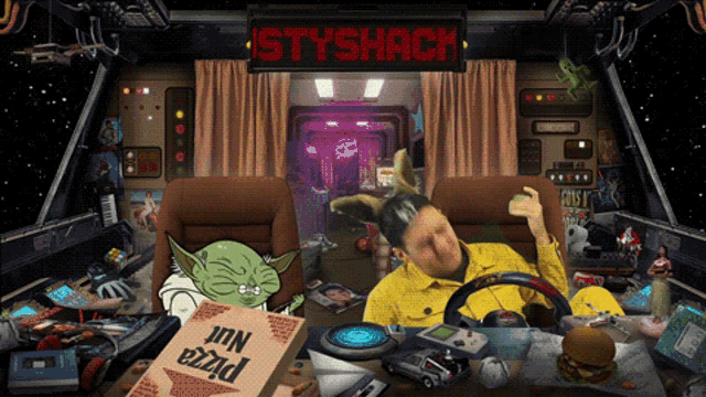 a box of pizza sits on a table in front of a sign that says ' styshack '