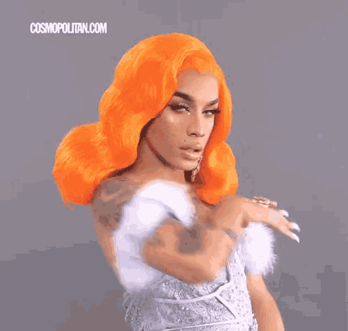a woman with orange hair and a white dress is covering her nose with her hand .