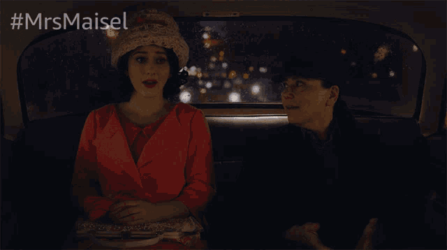 a poster for mrs maisel shows two women sitting in the back of a car