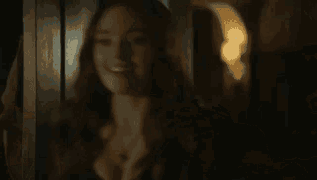 a person is standing in a dark room with a flashlight shining on them .