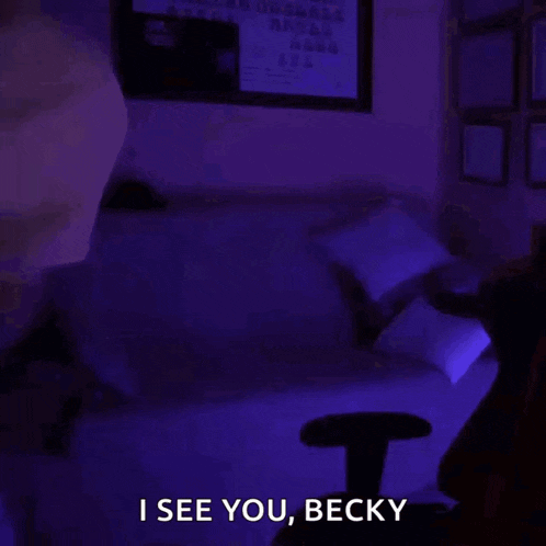 a man with a beard is wearing a monday shirt and says i see you becky