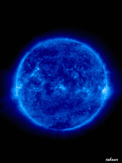a picture of a blue sun with a black background and the name tahaar on the bottom right