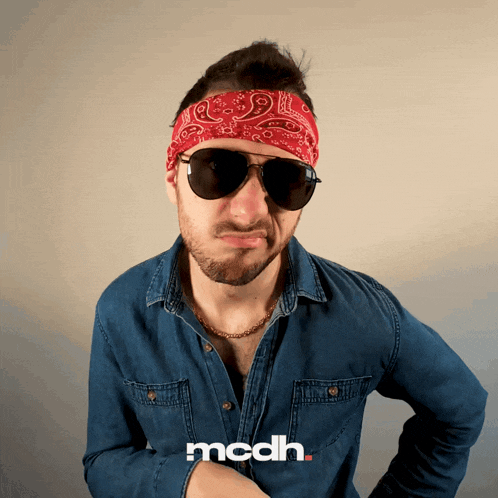 a man wearing sunglasses and a bandana has the word mcdh on the bottom