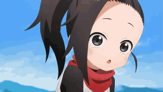 a little girl with a red scarf around her neck looks at the camera