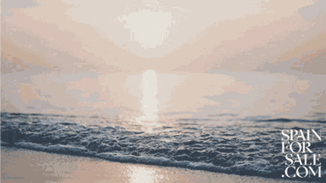 a picture of the ocean with the words spain for sale.com