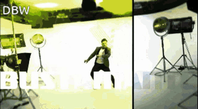 a man in a suit is dancing in front of a sign that says ' dbw '