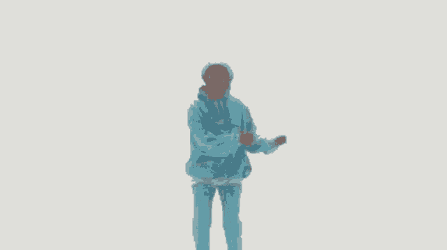 a man wearing a blue jacket and pants is dancing