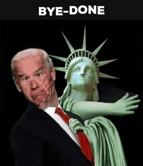 a man in a suit and tie is standing in front of a statue of liberty .